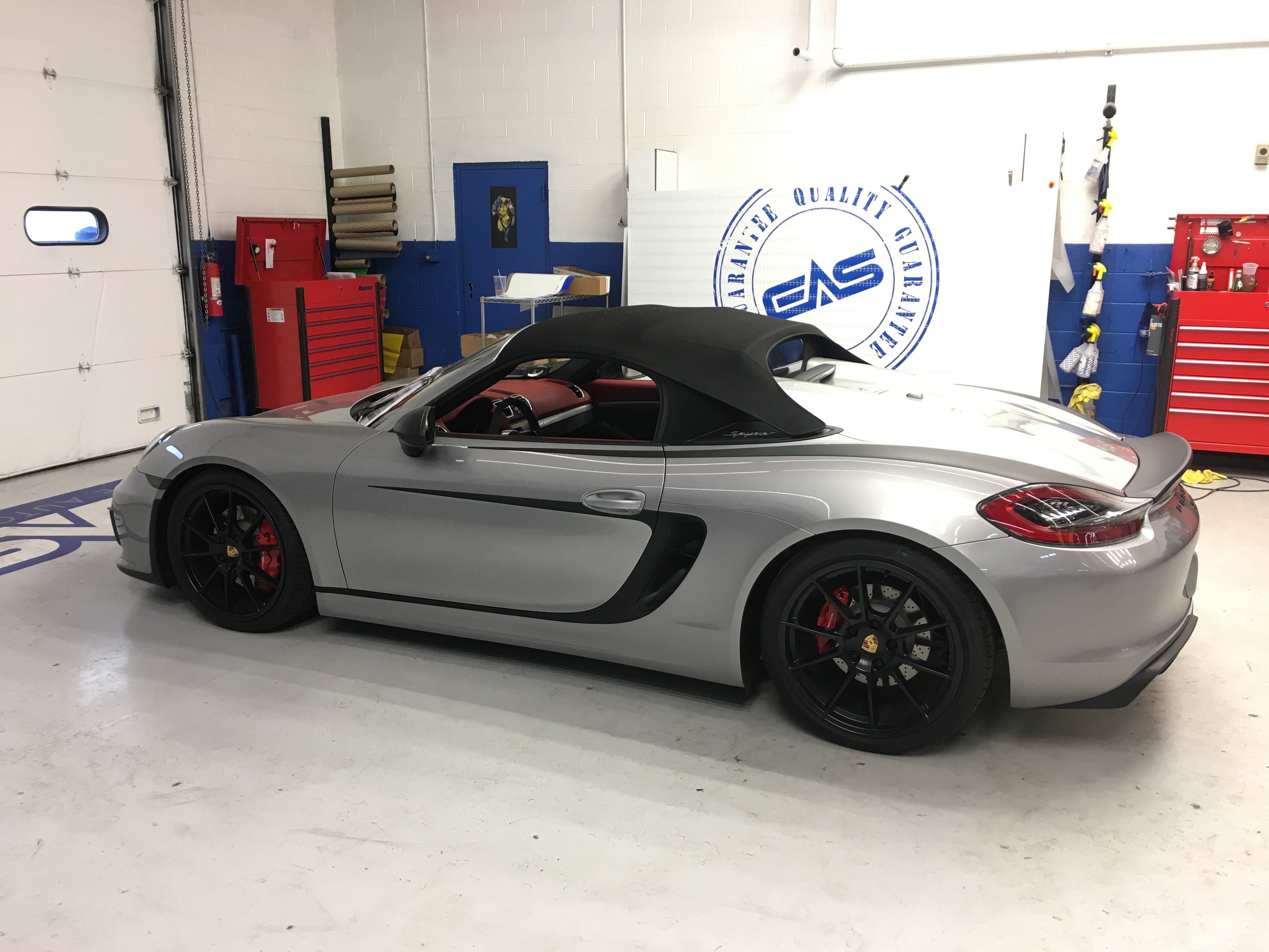 Silver Porsche in garage