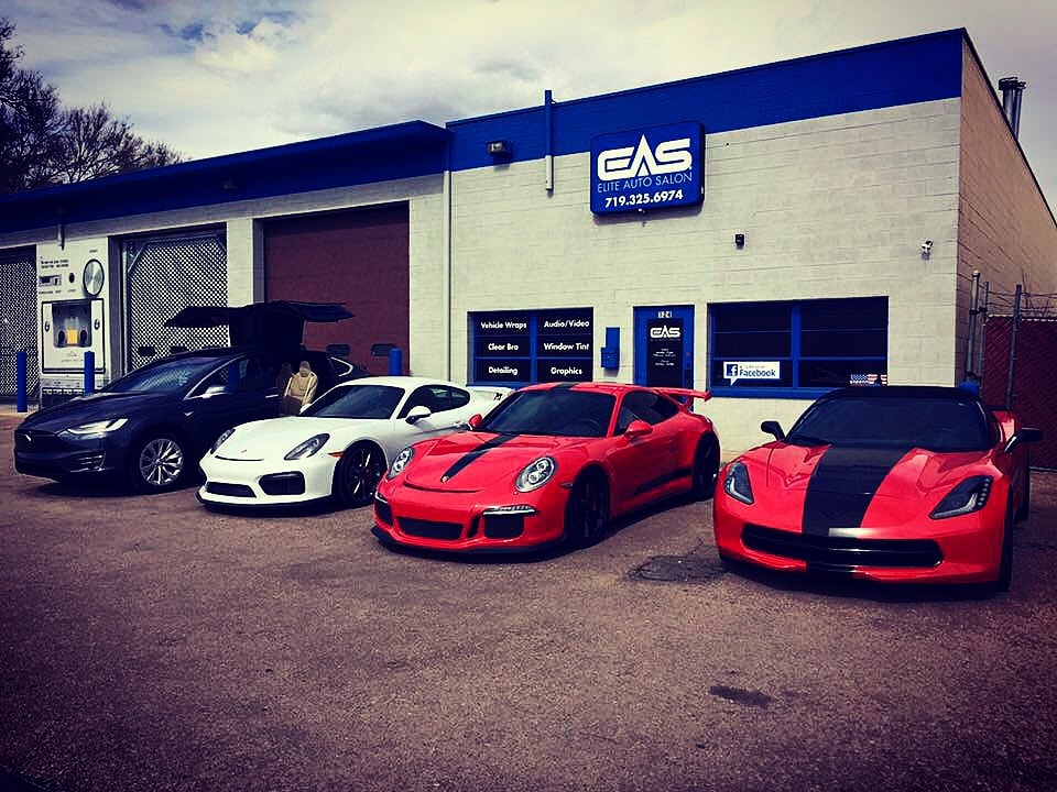 Luxury sports cars lined up outside the shop