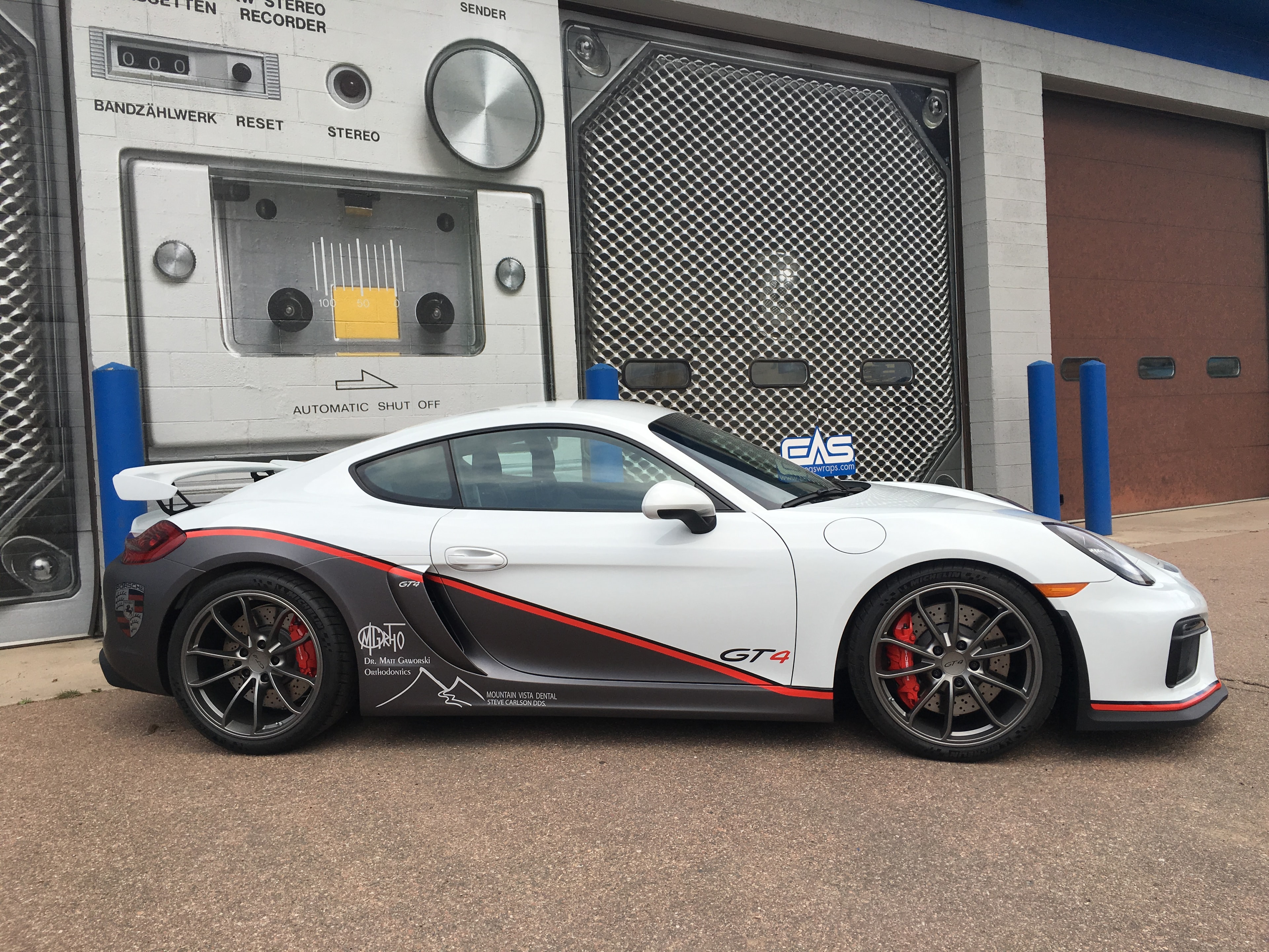 White Porsche GT4 side profile