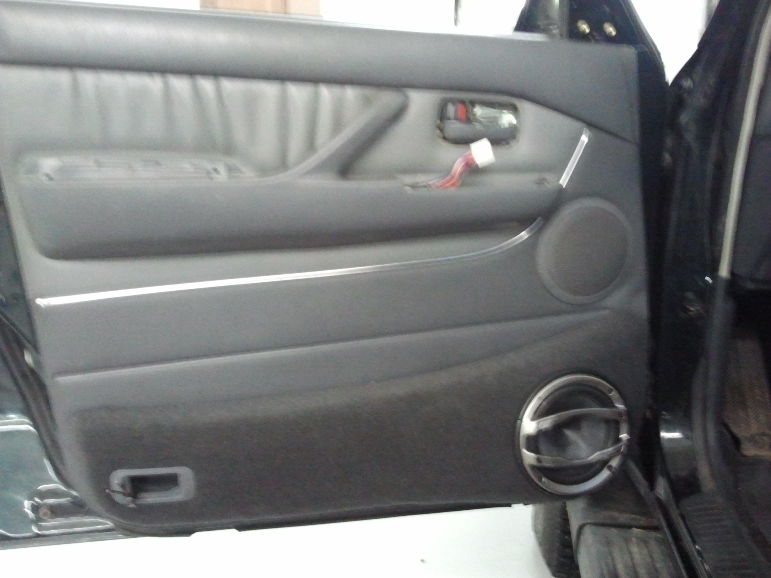 Door panel with custom audio installation in progress